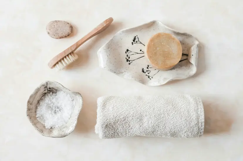 Illustrative spa mat and folded towels in soft light